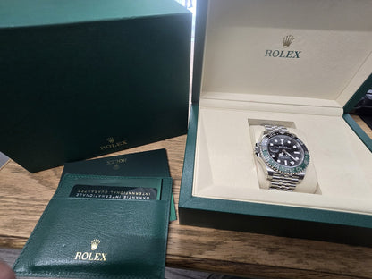 Rolex GMT Master II 126720VTNR watch with green and black bezel, full set, detailed close-up of the luxury timepiece.