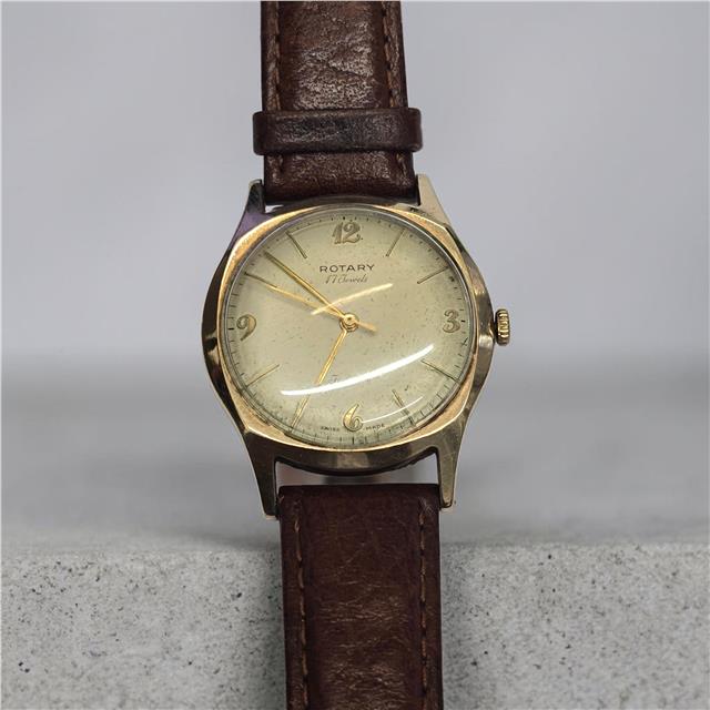 9ct yellow gold Rotary watch with a classic round face and elegant design, showcasing the luxurious timepiece.