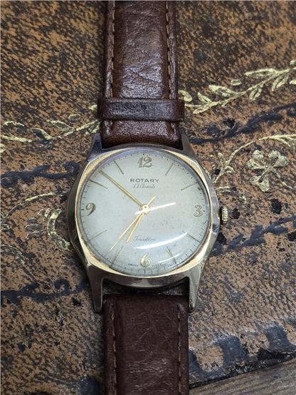 9ct yellow gold Rotary watch featuring a classic round dial and elegant design, displayed on a white background.