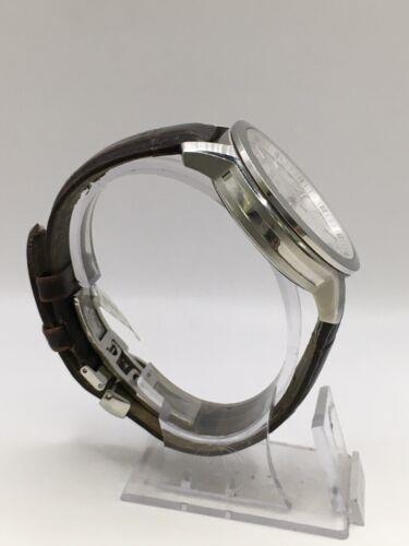 Elegant Tissot gents watch with a sleek design, stainless steel case, and black leather strap, showcasing a classic timepiece.
