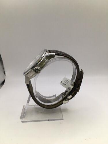 Elegant Tissot gents' watch with a silver dial and stainless steel band, showcasing a classic and sophisticated design.