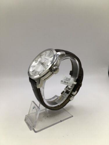 Elegant Tissot gents watch with a black dial and stainless steel band, showcasing a classic and sophisticated design.