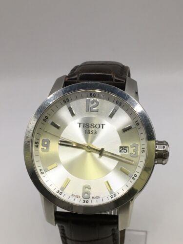 Elegant Tissot men's watch with a silver dial and stainless steel band, showcasing a classic and sophisticated design.