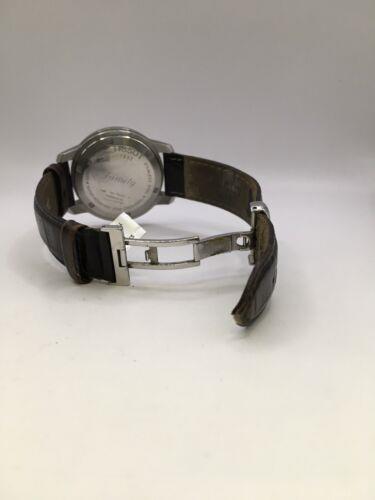Elegant Tissot men's watch with a silver dial and stainless steel band, showcasing a classic and sophisticated design.