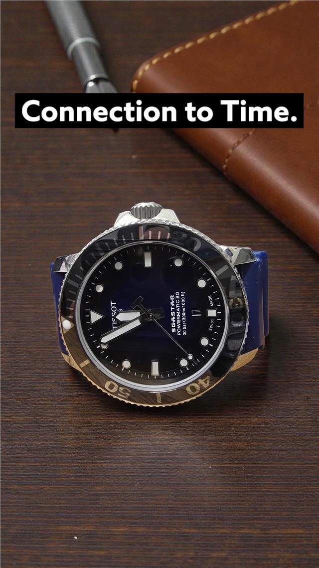 Tissot Seastar Power Matic 80 watch with boxed papers, showcasing the stainless steel case and black dial.