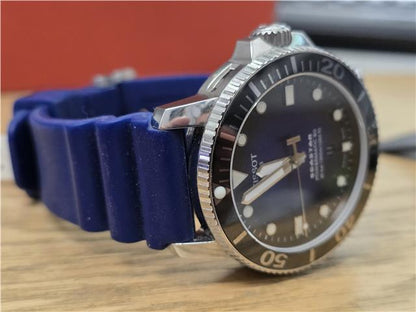 Tissot Seastar Power Matic 80 watch with boxed papers, stainless steel case, and black dial.