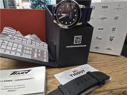 Tissot Seastar Power Matic 80 watch with boxed papers, featuring a stainless steel case and black dial.
