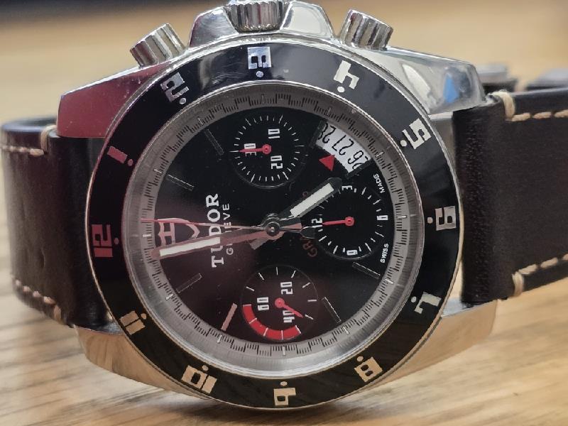 Tudor 20350N watch full set with box and papers, vintage 2011 model, featuring stainless steel bracelet and black dial.