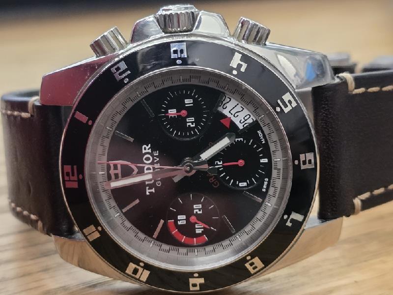 Tudor 20350N watch full set from 2011 featuring stainless steel bracelet and classic design, displayed with accessories and box.