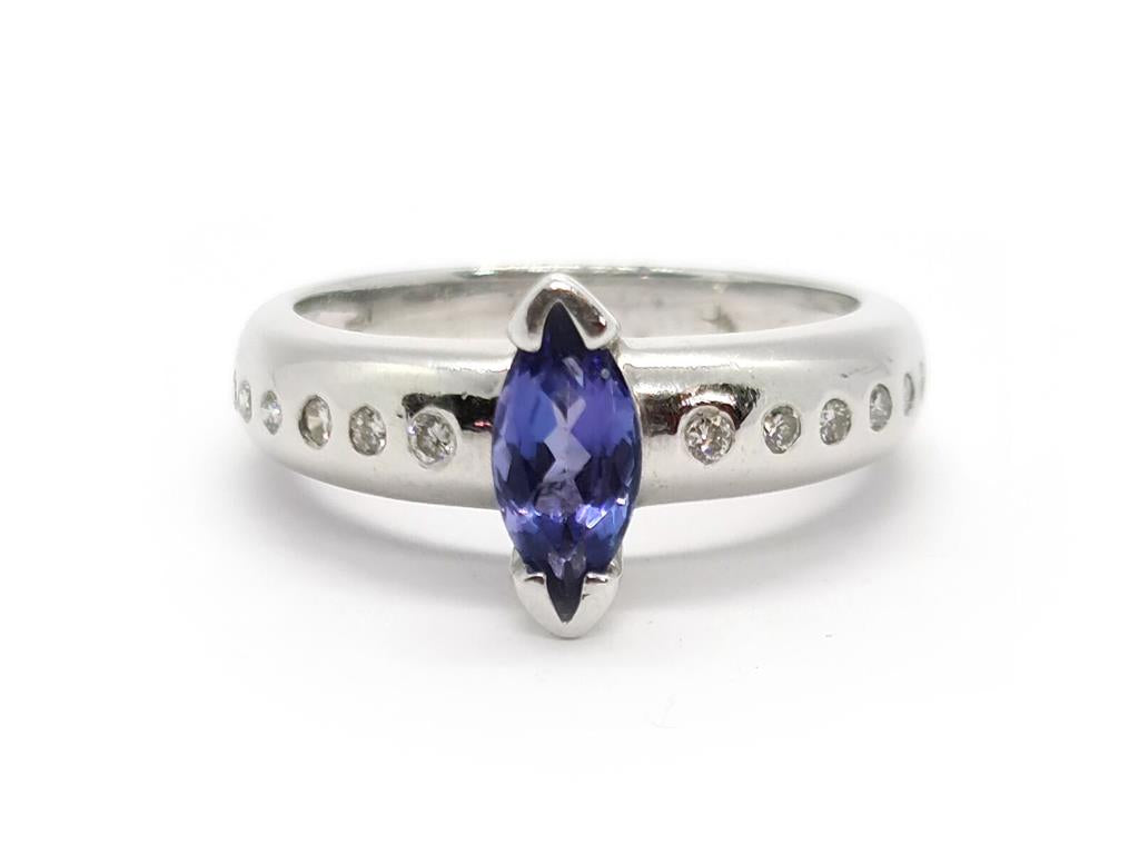 14ct tanzanite and diamond ring featuring a vibrant blue tanzanite gemstone set in a 14-karat band
