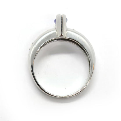 14ct tanzanite and diamond ring featuring a 0.85 carat tanzanite gemstone set in a sleek band