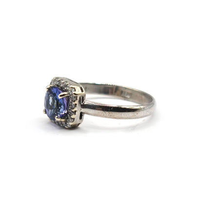 14ct diamond halo style ring featuring 1.10 CRT of sparkling diamonds in a classic design.