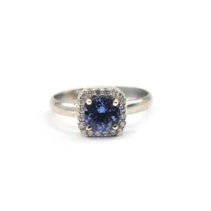 14ct diamond halo ring with 1.10 carats total weight featuring sparkling diamonds set in a classic style.