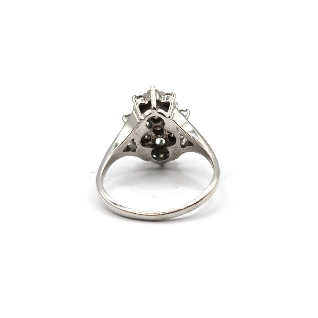 14ct white gold diamond cluster ring featuring a 1.12 carat sparkling diamond design on a sleek band.