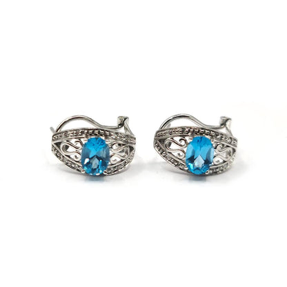 14ct white gold topaz and diamond earrings with post and lever back, featuring 1.70 carats of vibrant blue topaz and sparkling diamonds