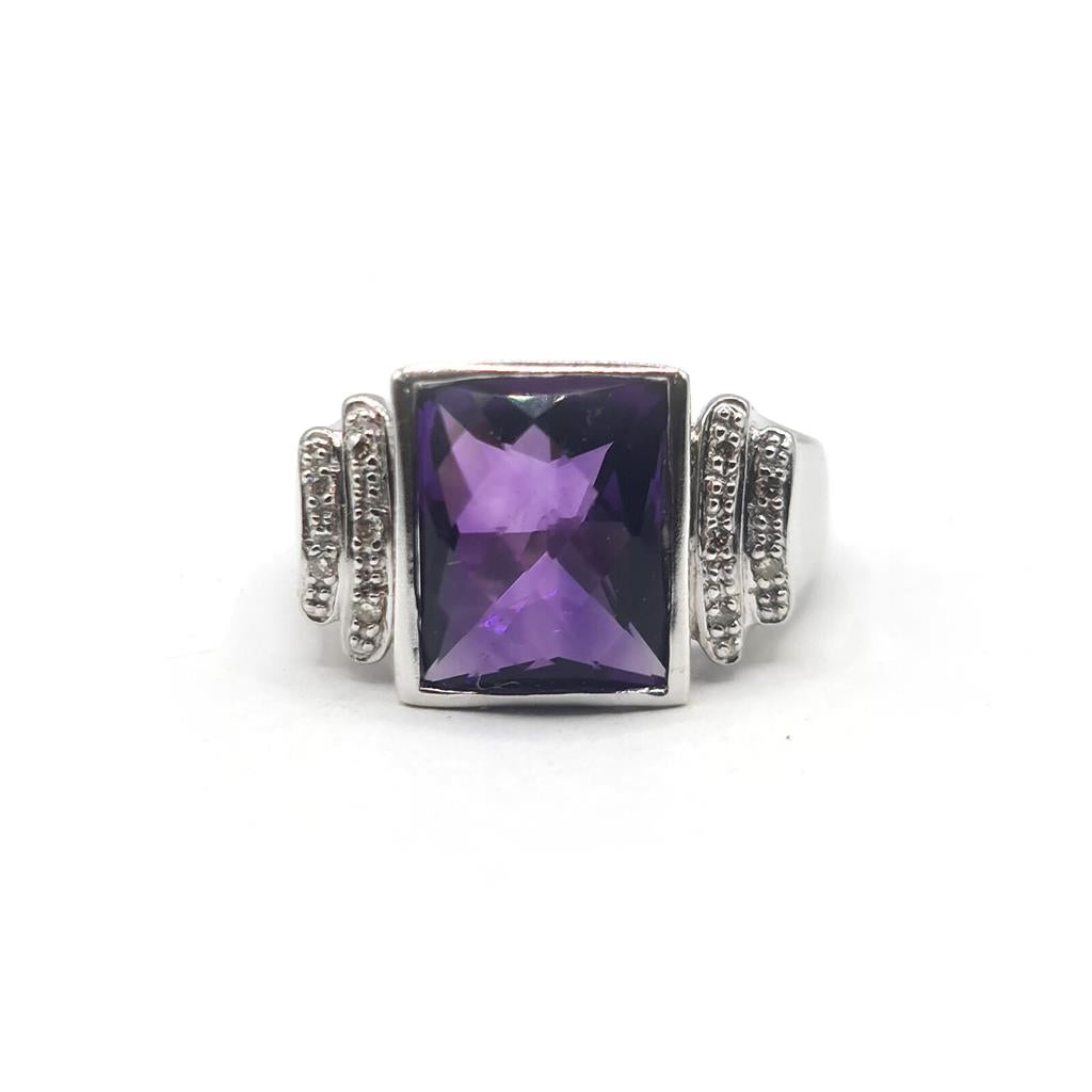 14ct white gold ring featuring a 4.25-carat amethyst gemstone accented with small diamonds, elegant jewelry piece.
