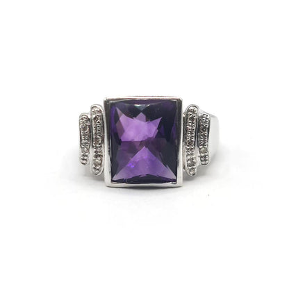 14ct white gold ring featuring a 4.25-carat amethyst gemstone accented with small diamonds, elegant jewelry piece.