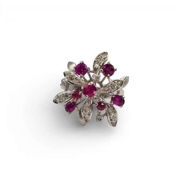 14ct white gold ring featuring a vibrant ruby center stone accented with sparkling diamonds, elegant jewelry piece.