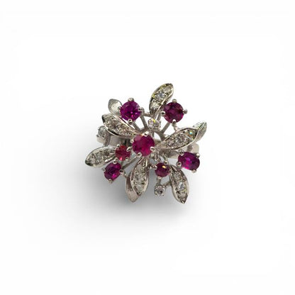 14ct white gold ring featuring a vibrant ruby center stone accented with sparkling diamonds, elegant jewelry piece.