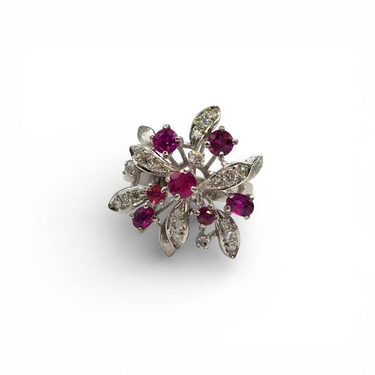 14ct white gold ring featuring a vibrant ruby center stone accented with sparkling diamonds, elegant jewelry piece.