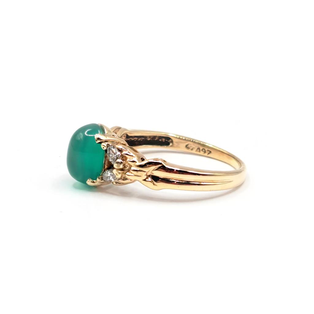14ct yellow gold ring featuring a 1.15 carat chrysoprase gemstone and 0.20 carat diamond accents.