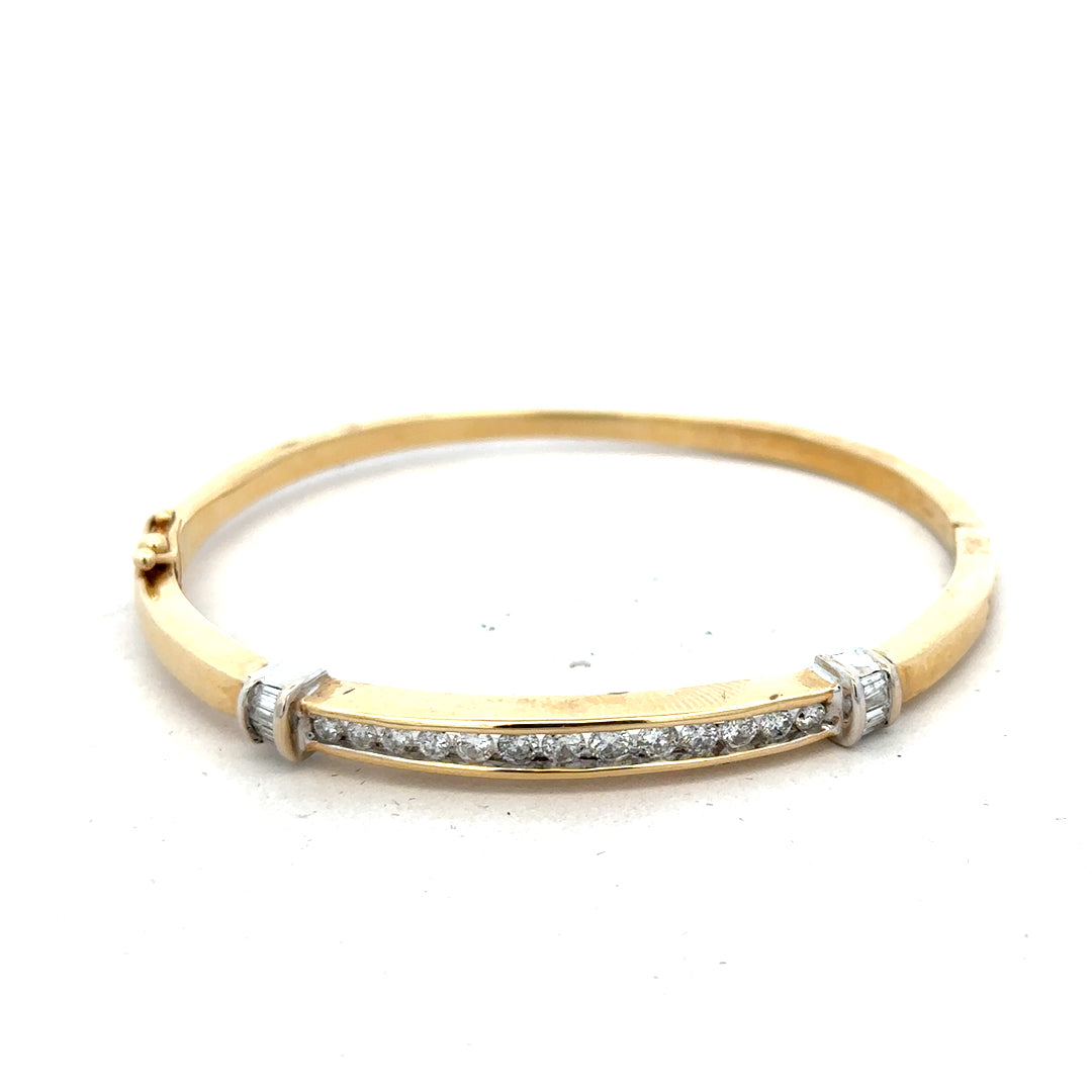 14ct yellow gold diamond bangle with 1 carat total weight, featuring sparkling diamonds and a sleek, elegant design.