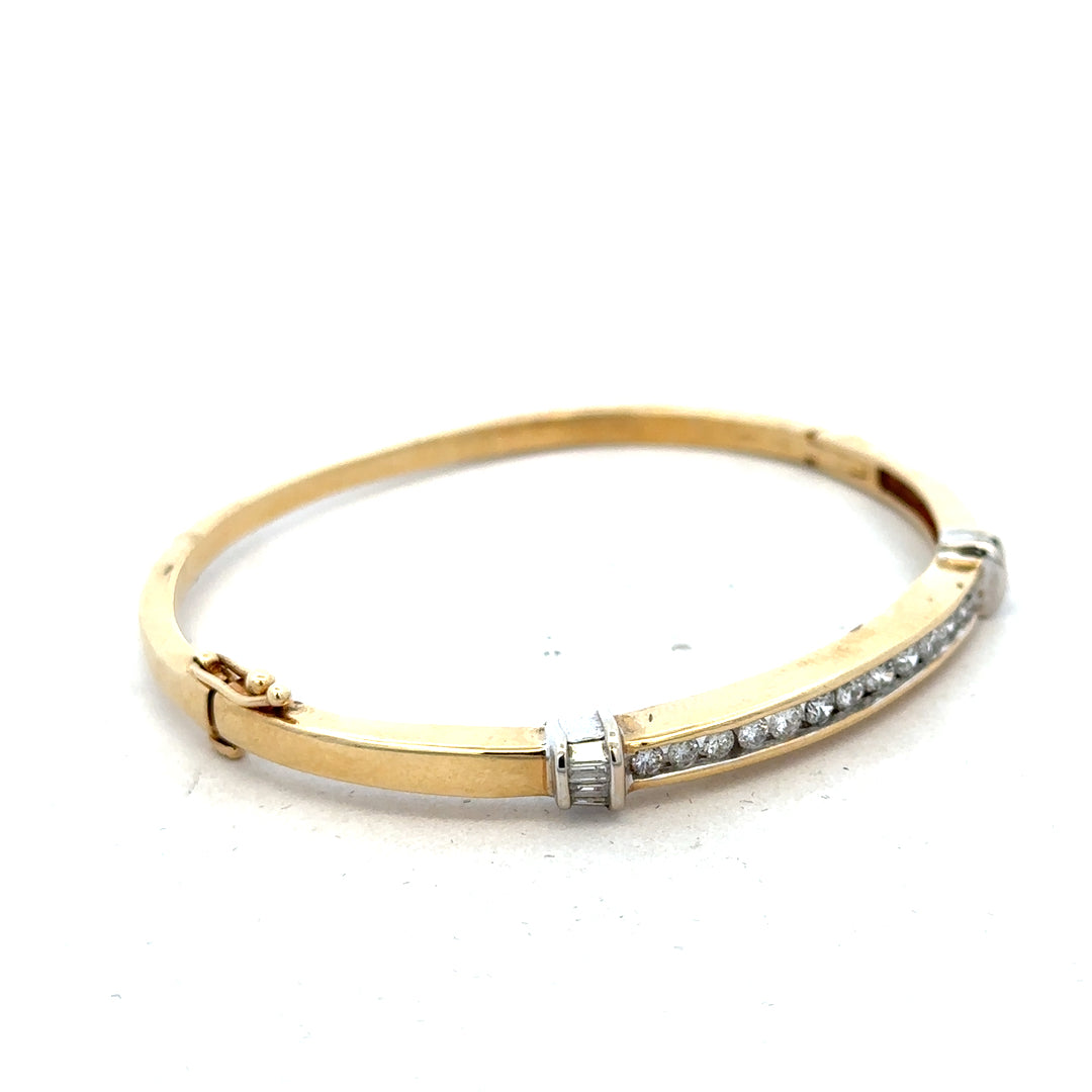 14ct yellow gold diamond bangle with 1-carat sparkle, weighing 17.5g, featuring a sleek and elegant design.
