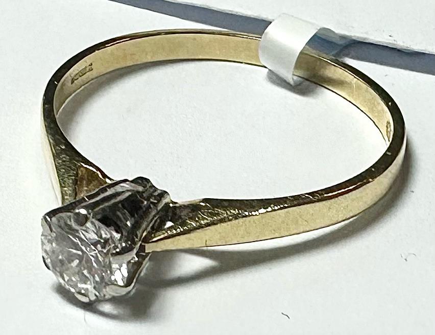 14ct yellow gold diamond ring in size P, featuring a sparkling diamond centerpiece and elegant band design.