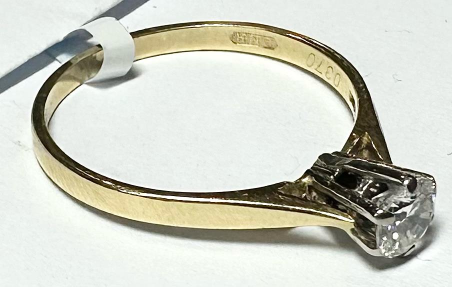 14ct yellow gold diamond ring in size P, featuring a sparkling diamond set in a classic band.