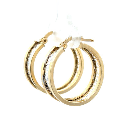 14ct yellow gold earrings weighing 4.2g, featuring a classic design, shown on a neutral background.