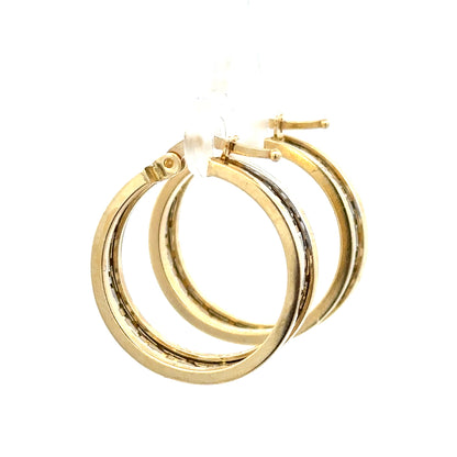 14ct yellow gold earrings with a delicate design, weighing 4.2 grams, showcasing elegant jewelry craftsmanship.