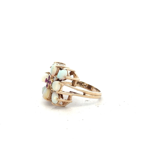 14ct yellow gold opal ring in size L1/2, featuring a vibrant opal gemstone set in a simple gold band.