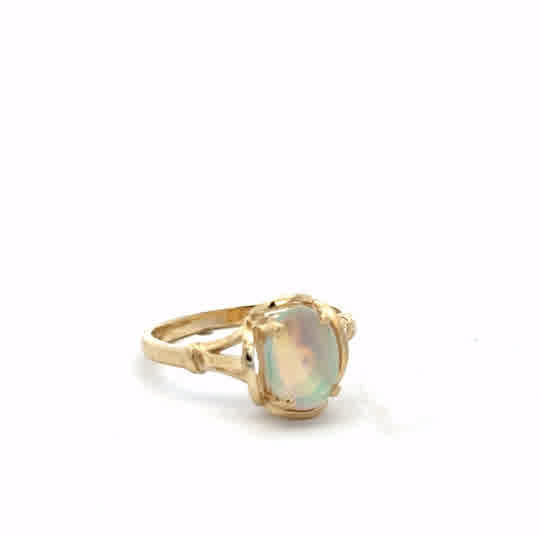 14ct yellow gold opal ring in size N, featuring a vibrant opal gemstone set in a polished gold band.
