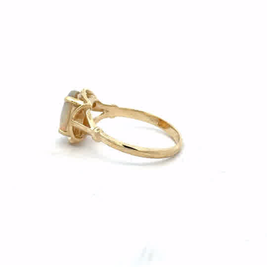 14ct yellow gold opal ring in size N featuring a vibrant opal gemstone and a sleek gold band.