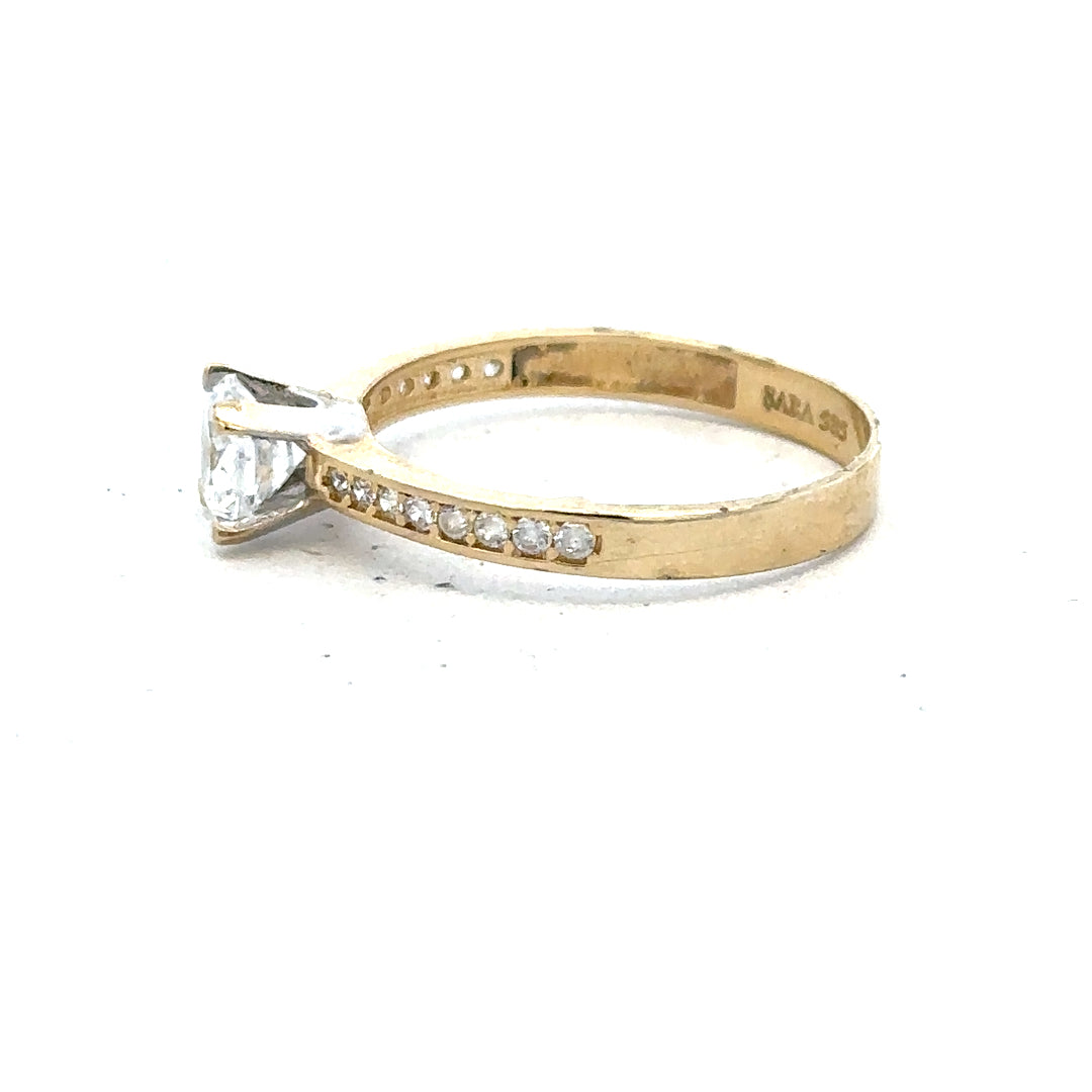 14ct yellow gold ring in size O with a smooth band, unbranded jewelry piece displayed against a neutral background.