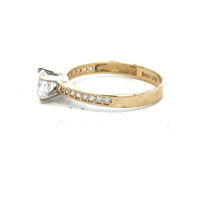 14ct yellow gold ring in size O with a smooth band, unbranded jewelry piece displayed against a neutral background.