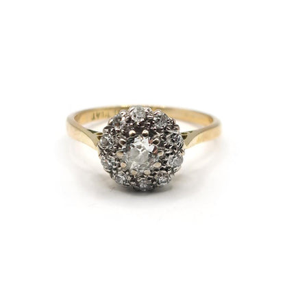 18ct gold diamond cluster ring with 0.55 carats of sparkling diamonds, featuring a classic and elegant design.