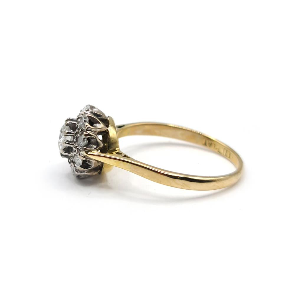 18ct gold diamond cluster ring with 0.55 carats of sparkling diamonds, featuring a elegant, unbranded design.