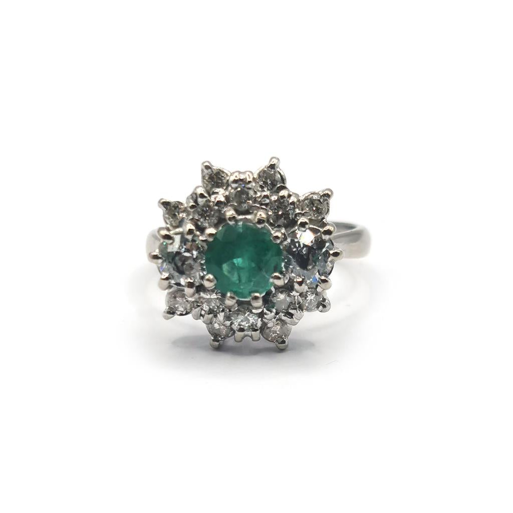 18ct gold ring with a 0.65 carat emerald and 1.15 carat diamond, showcasing a stunning gemstone design.