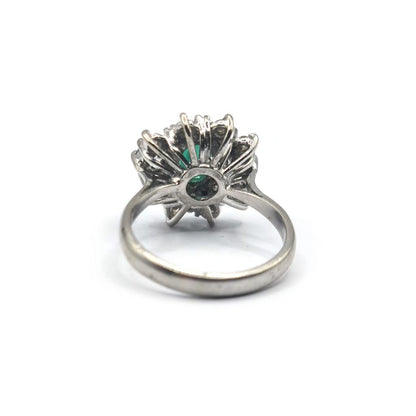 18ct gold ring featuring a 0.65 carat emerald and 1.15 carat diamond, set in a elegant jewelry design.
