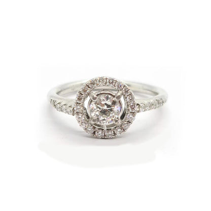 18ct gold diamond halo ring with 0.80ct center stone and surrounding smaller diamonds, elegant jewelry piece.