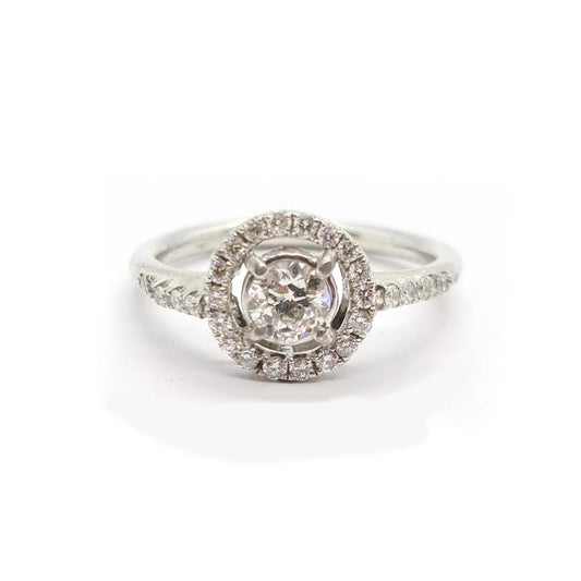 18ct gold diamond halo ring with 0.80ct center stone and surrounding smaller diamonds, elegant jewelry piece.