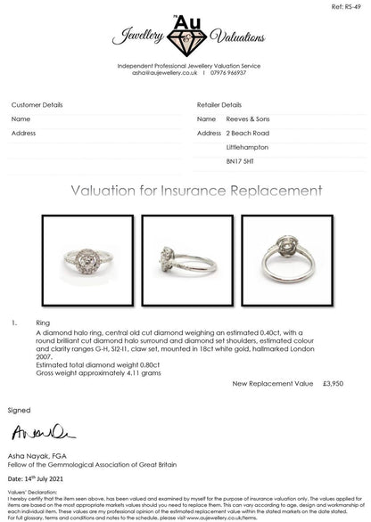 18ct gold diamond halo ring with 0.80ct center diamond and surrounding smaller diamonds, elegant jewelry piece.