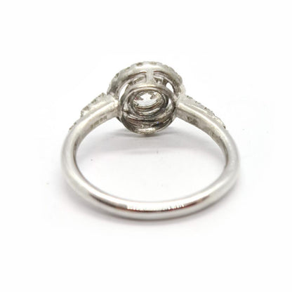 18ct gold diamond halo ring with 0.80ct sparkling central diamond and intricate halo setting.
