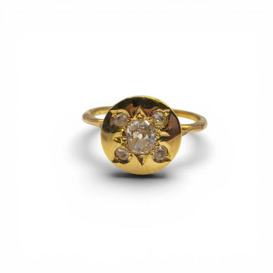 Antique 18ct yellow gold diamond ring with intricate detailing, showcasing sparkling diamonds on a vintage-style band.