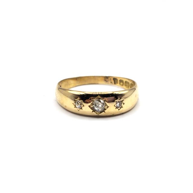 18ct diamond ring featuring sparkling diamonds set in a sleek band, unbranded jewelry design.