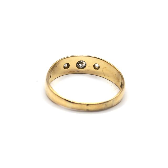 18ct diamond ring with sparkling diamonds set in a sleek band, unbranded jewelry piece, detailed close-up view.
