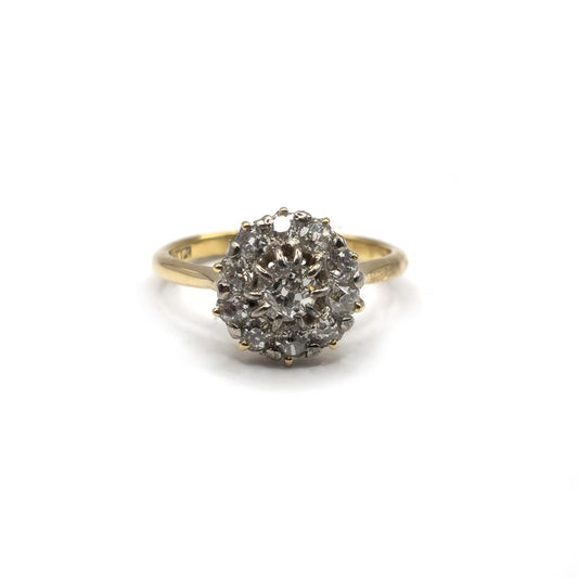 18ct diamond ring with a sleek band and sparkling diamonds, showcasing elegant jewelry craftsmanship.