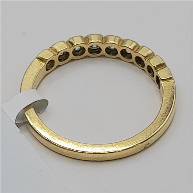 18ct diamond ring in size N featuring sparkling diamonds on a sleek band, unbranded, elegant jewelry accessory.