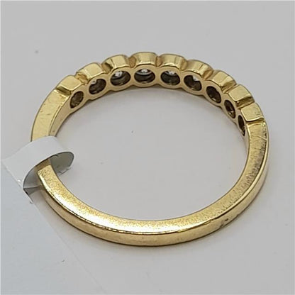 18ct diamond ring in size N featuring sparkling diamonds on a sleek band, unbranded, elegant jewelry accessory.